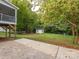 Expansive backyard with sheds, a patio and lots of trees offering natural privacy at 1204 Allenbrook Dr, Charlotte, NC 28208