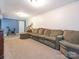 Finished basement recreation room with sectional sofa and exercise bike at 1204 Allenbrook Dr, Charlotte, NC 28208