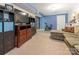 Large basement recreation area, TV, storage, and exercise bike at 1204 Allenbrook Dr, Charlotte, NC 28208