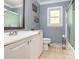 Bathroom features a shower/tub combo, white vanity, and updated fixtures at 1204 Allenbrook Dr, Charlotte, NC 28208