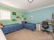 Twin bedroom with built-in shelves and desks at 1204 Allenbrook Dr, Charlotte, NC 28208