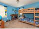 Colorful bedroom with a wooden bunk bed and playful decor at 1204 Allenbrook Dr, Charlotte, NC 28208