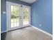 French doors open to a backyard patio at 1204 Allenbrook Dr, Charlotte, NC 28208