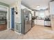 Modern kitchen with stainless steel refrigerator and white cabinetry at 1204 Allenbrook Dr, Charlotte, NC 28208