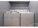 Basement laundry room with washer and dryer at 1204 Allenbrook Dr, Charlotte, NC 28208