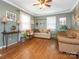 Living room with hardwood floors, two sofas, and a ceiling fan at 1204 Allenbrook Dr, Charlotte, NC 28208