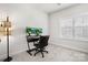 Home office featuring a modern desk, chair, and dual monitors with window at 122 Lanyard Dr # C, Mooresville, NC 28117