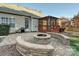 Brick fire pit and patio with screened porch at 12434 Kemerton Ln, Huntersville, NC 28078