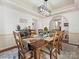 Bright dining room with hardwood floors, a large wooden table, and lots of light at 12434 Kemerton Ln, Huntersville, NC 28078