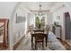 Formal dining room with hardwood floors, a wooden table, and a chandelier at 12434 Kemerton Ln, Huntersville, NC 28078