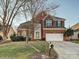 Brick two-story house with a two-car garage at 12434 Kemerton Ln, Huntersville, NC 28078