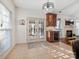 Kitchen with breakfast bar, wine cooler, and access to outdoor patio at 12434 Kemerton Ln, Huntersville, NC 28078