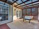 Relaxing covered patio with seating and string lights at 12434 Kemerton Ln, Huntersville, NC 28078