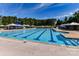 Resort-style pool with umbrellas and comfortable seating at 12434 Kemerton Ln, Huntersville, NC 28078