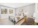 Bedroom with metal bed frame and wood-look floors at 126 Abbey Ln, Mount Gilead, NC 27306