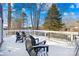 Deck overlooking the lake with snow and Adirondack chairs at 126 Abbey Ln, Mount Gilead, NC 27306