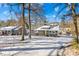 Modern home with yellow door and driveway, snow on the ground at 126 Abbey Ln, Mount Gilead, NC 27306