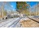 Lakefront home with gray exterior, snow-covered yard, and modern design at 126 Abbey Ln, Mount Gilead, NC 27306