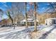 Modern lake house with yellow door and snow covered lawn at 126 Abbey Ln, Mount Gilead, NC 27306