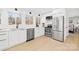 Bright kitchen boasts stainless steel appliances and white cabinets at 126 Abbey Ln, Mount Gilead, NC 27306