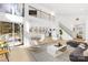 Bright open concept living room with modern decor, light wood floors and lots of natural light at 126 Abbey Ln, Mount Gilead, NC 27306