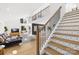 Bright and open living room with decorative stair risers and a modern design at 126 Abbey Ln, Mount Gilead, NC 27306