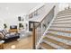 Modern staircase with geometric patterned risers and sleek metal railing at 126 Abbey Ln, Mount Gilead, NC 27306