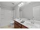 Bathroom with double vanity, shower/tub combo, and mirror at 13303 Hyperion Hills Ln, Charlotte, NC 28278