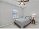 Comfortable bedroom with neutral decor and large window at 13303 Hyperion Hills Ln, Charlotte, NC 28278