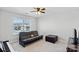 Bedroom with futon, ottoman, and large window at 13303 Hyperion Hills Ln, Charlotte, NC 28278