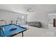 Bonus room with pool table and comfortable seating at 13303 Hyperion Hills Ln, Charlotte, NC 28278