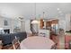 Open concept dining area with kitchen and living room views at 13303 Hyperion Hills Ln, Charlotte, NC 28278