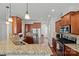 Kitchen with granite countertops, stainless steel appliances, and wood cabinets at 13303 Hyperion Hills Ln, Charlotte, NC 28278