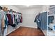 Large walk-in closet with ample shelving and hanging space at 13303 Hyperion Hills Ln, Charlotte, NC 28278