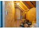 Unfinished attic space with wood framing and storage items at 138 Augusta Ln, Shelby, NC 28150