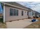 House back exterior with patio and two blue planters at 138 Augusta Ln, Shelby, NC 28150