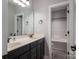 Bathroom with double vanity, dark brown cabinets, and shower/tub combo at 138 Augusta Ln, Shelby, NC 28150