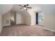 Spacious bedroom with ceiling fan, window with blue curtains and carpet floor at 138 Augusta Ln, Shelby, NC 28150