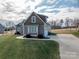 Side view of the house, highlighting the garage and driveway at 138 Augusta Ln, Shelby, NC 28150