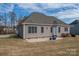 Rear view of house showcasing patio and landscaping at 138 Augusta Ln, Shelby, NC 28150