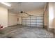 Spacious garage interior with an automatic garage door at 138 Augusta Ln, Shelby, NC 28150