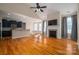 Open kitchen with breakfast bar, dark cabinetry, and granite counters at 138 Augusta Ln, Shelby, NC 28150