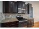 Modern kitchen with granite countertops and stainless steel appliances at 138 Augusta Ln, Shelby, NC 28150