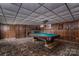 Basement gameroom featuring a billiard table and fireplace at 1408 Gaither Rd, Belmont, NC 28012