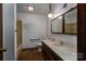 Bathroom with double vanity and shower/tub combo at 1408 Gaither Rd, Belmont, NC 28012