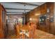 Dining area with kitchen view and wood paneling at 1408 Gaither Rd, Belmont, NC 28012