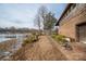 Brick house, lakeside view, and walkway leading to garage at 1408 Gaither Rd, Belmont, NC 28012