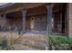 Brick steps leading to a front porch with ornate railing at 1408 Gaither Rd, Belmont, NC 28012