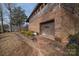 Brick home showcasing a large garage door and side yard at 1408 Gaither Rd, Belmont, NC 28012