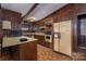 Kitchen with wood cabinets, appliances, and flooring at 1408 Gaither Rd, Belmont, NC 28012